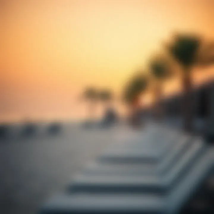 Sunset Scene at Beach La Mer Relaxing sunset scene at Beach La Mer with sun loungers and palm trees