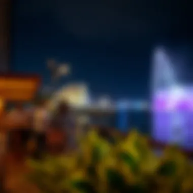 Visitors enjoying the Dubai Fountain show from a waterfront cafe